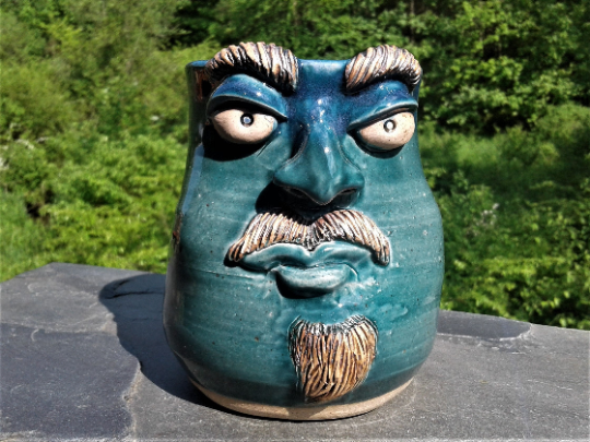 Blue face much with mustache
